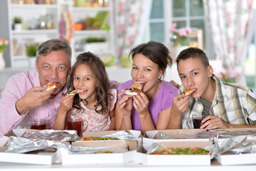 Portrait of beautiful family cooking at kitchen