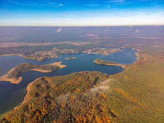 Vibrant Autumn Lakescape with Islands. A stunning aerial view of interconnected lakes surrounded by...