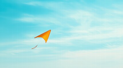 Colorful Kite Flying High Against a Clear Blue Sky