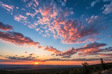 Fototapeta premium A Stunning Sunrise with a Clear Blue Sky and Glowing Pink Clouds, Casting a Soft Radiance Over the Tranquil Morning Horizon