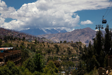 Beautiful city of La Paz from the observation deck. Buildings and mountains in the background. Blue sky. Beautiful architecture.