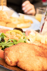 dish of breaded chicken or fish and salad close-up healthy close-up