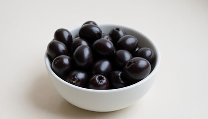 Bowl of Spanish olives in realistic style in black colors with copy space