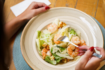 Shrimp Caesar salad with Parmesan and croutons