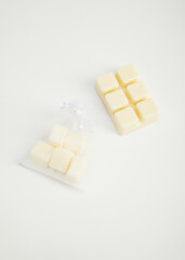 aromatic coconut wax in cubes for use as sachets or in aromatherapy. Photo on a white background