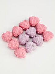 heart-shaped bath bombs on a white background