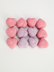heart-shaped bath bombs on a white background