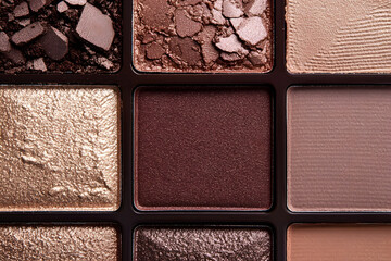Fototapeta premium Eyeshadow colorful shades palette in mocha mousse tones close-up