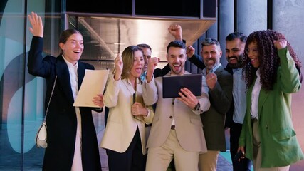 Excited Business Team Celebrating Success with a Tablet