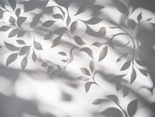 A delicate paper design featuring leaf patterns casting soft shadows on a light background.