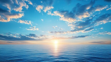 Obraz premium A serene sunrise over the calm ocean horizon with fluffy clouds