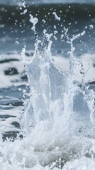 Ocean water splashing with droplets flying and crashing waves, illustrating the dynamic energy of the sea in motion.