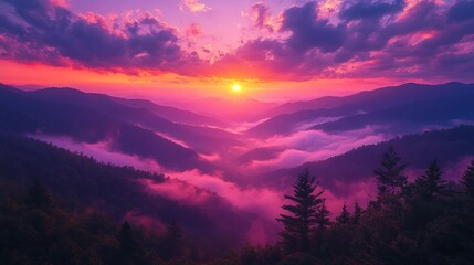 Obraz premium Vibrant sunset over misty mountain valley.