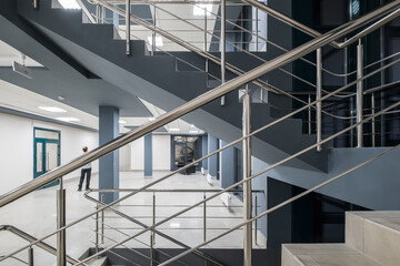 Fototapeta premium stairs emergency and evacuation exit stair in up ladder in a new office building at night