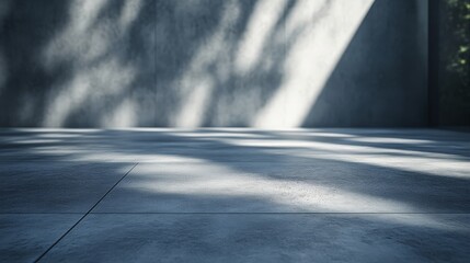 A serene concrete space featuring soft shadows and light patterns, evoking a tranquil and minimalistic ambiance.