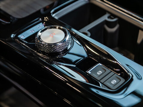 Novosibirsk, Russia -  December 10, 2024:  Haval Dargo,  close-up of  parking brake, auto hold buttons. modern car interior