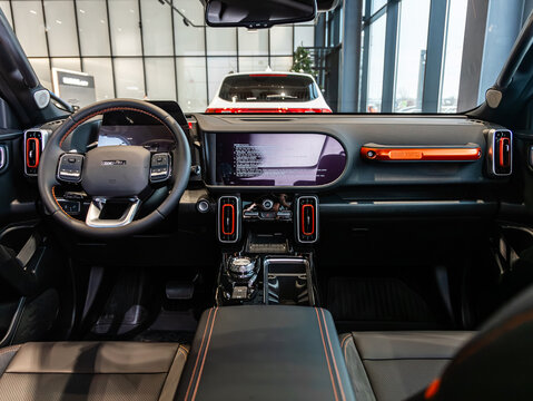 Novosibirsk, Russia -  December 10, 2024:  Haval Dargo, car Interior - steering wheel, shift lever and dashboard, climate control, speedometer, display. Salon of a new stylish car.