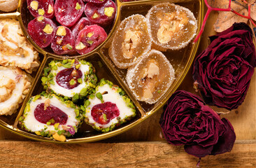 Sweet food Turkish delight on wooden background, assorted locum and candy as decorated backdrop
