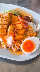 Red pork and crispy pork on rice, food in Thailand