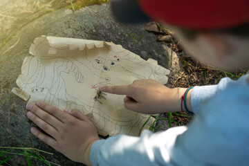 A quest for children in the fresh air. Children play pirates while exploring an ancient treasure map.