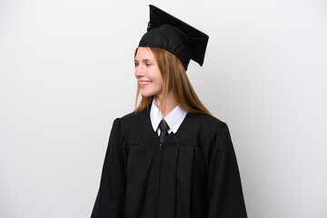 Young university graduate English woman isolated on white background looking side