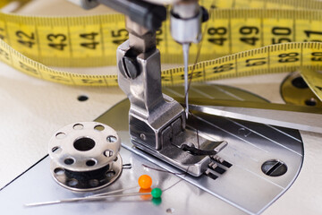 Industrial sewing machine pressure foot and sewing accessories closeup