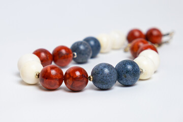Close-up of beads with large round beads made of stone. Jewelry made of natural materials.