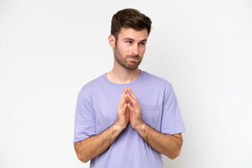 Young caucasian man isolated on white background scheming something