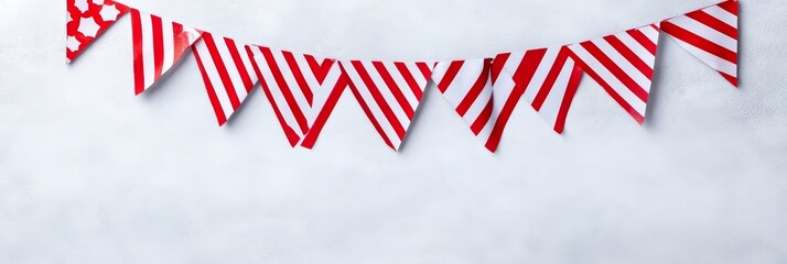 Obraz premium Festive Red and White Bunting Banner - Celebrate with this cheerful red and white striped bunting. Symbolizing joy, festivity, celebration, togetherness, and good times.