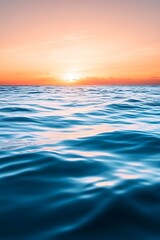 A smooth gradient wallpaper blending sunset orange to deep ocean blue with a soft glow 
