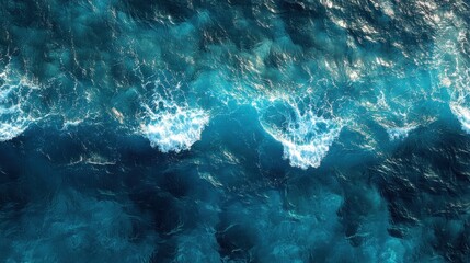 Aerial view of ocean waves with whitecaps.