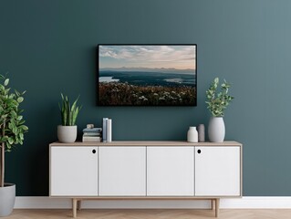 A modern living room featuring a sleek TV mounted on a green wall above a light wood console with plants and decorative items.
