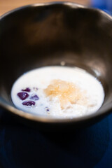 Thai glutinous rice balls with coconut milk.