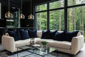 A sophisticated living room with a soft cream-colored sofa and navy pillows, a glass coffee