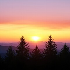 Obraz premium A vibrant sunset behind silhouetted trees, casting warm hues of orange and pink across the sky and mountains.