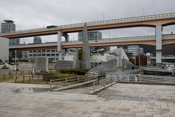 Kobe, Japan -March 6, 2024: cityscape carbridge, tsunami memorial and buildings