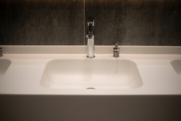 Fototapeta premium Sink with water. Tap for hand washing. Toilet room.