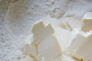 Combine the butter and baking flour in a large metal bowl. Close up.
