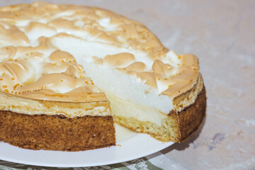 Table top photo of a sliced traditional pie on a glass plate with a cutout background. View from above.
