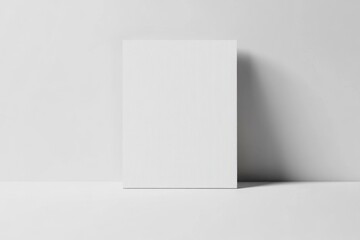 Blank canvas resting against wall in minimalist setting for creative art projects