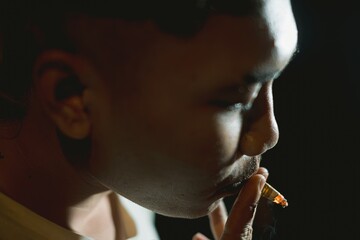 Young Southeast Asian man smoking