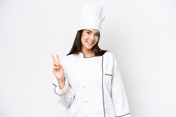 Young Brazilian chef woman isolated on white background smiling and showing victory sign