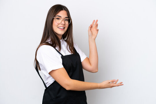 Restaurant Brazilian waiter woman isolated on white background extending hands to the side for inviting to come