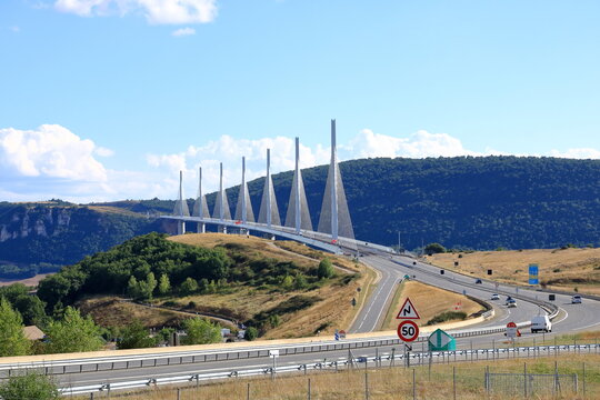 Millau, France, Europe - September 02 2024: cars crossing the multispan cable stayed Millau Viaduct across gorge valley of Tarn River