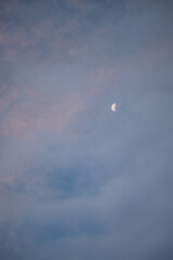 moon and clouds in the morning sky