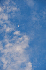 moon and clouds in the morning sky
