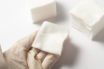 Lot of sterile cleansing swabs, nonwoven swab in hand in glowes