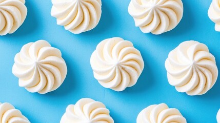 Decoratively Swirled Cream Confections on Blue Background
