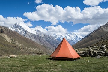 Orange Tent in Majestic Mountain Valley Landscape