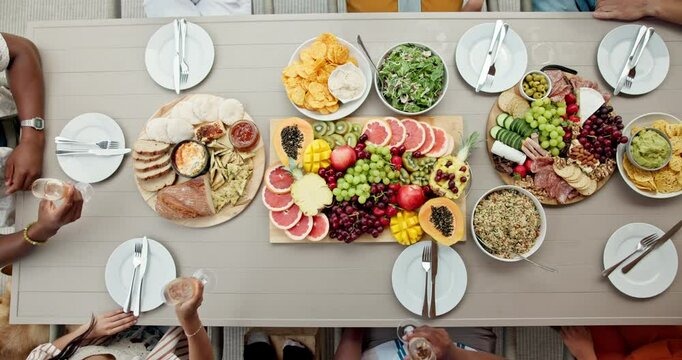 Friends, hands and toast with wine cheers for vacation, bonding and reunion. Above group of people, party and new years celebration with outdoor summer holiday for alcohol, champagne and brunch